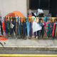 An array of donated umbrellas looks like a combination of a yard sale and an armory.